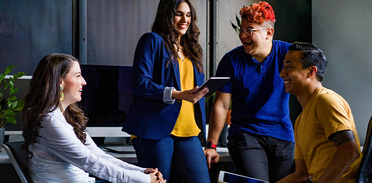 Employees laughing and talking together